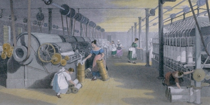 Las hilanderas del siglo diecinueve utilizan máquinas en el capitalismo industrial.